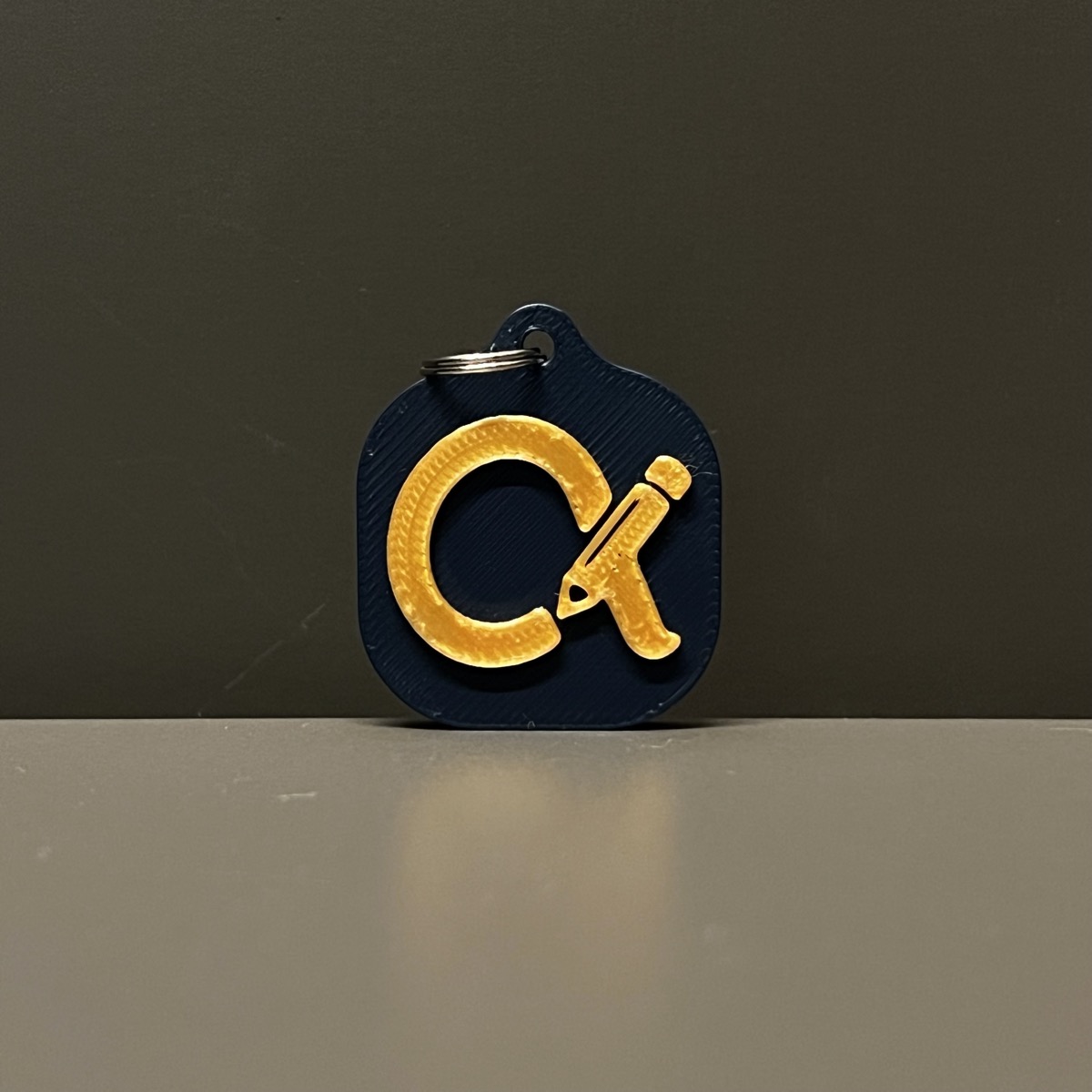 Navy and gold Ck keychain